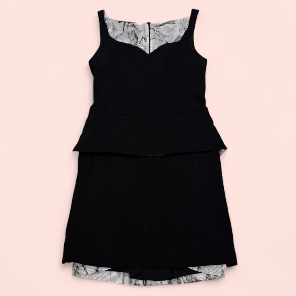 D. Exterior dress peplum peek a boo pleated marble print back